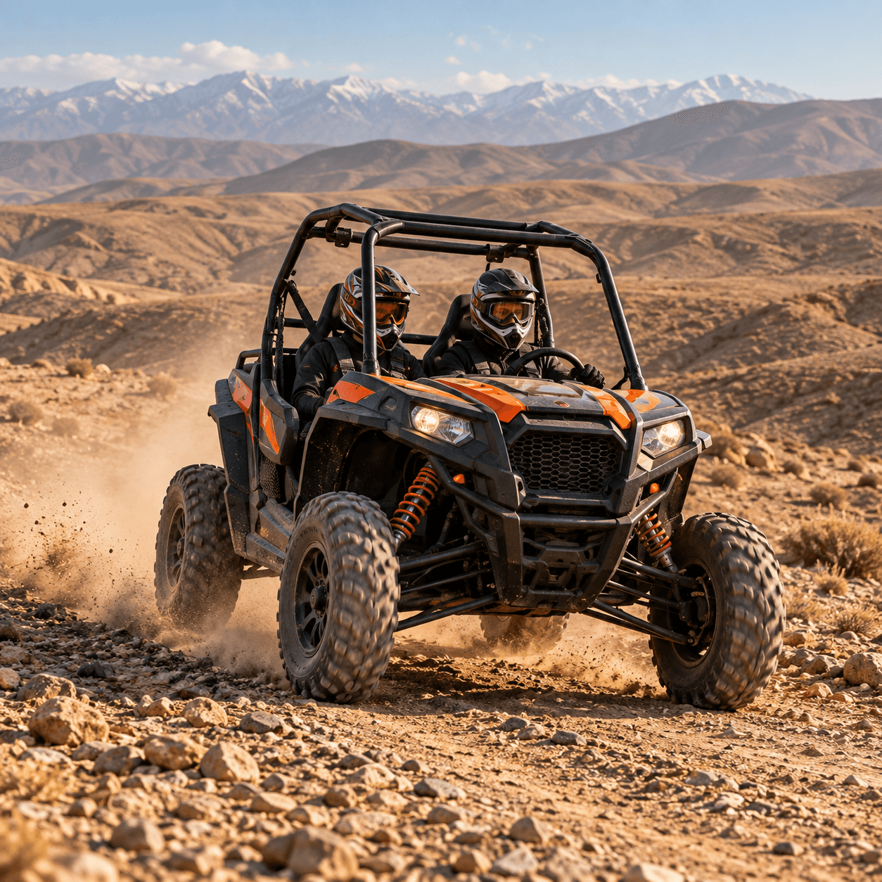 Two helmeted guests driving a buggy through the Agafay hills